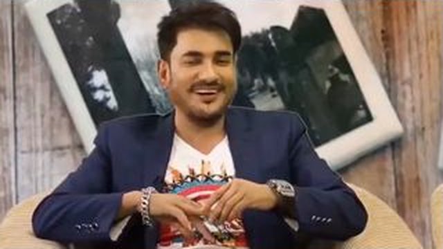 man smiling sitting