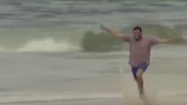 man running on beach