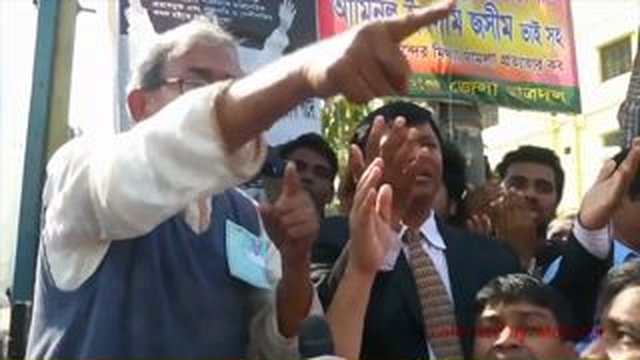 man points in crowd